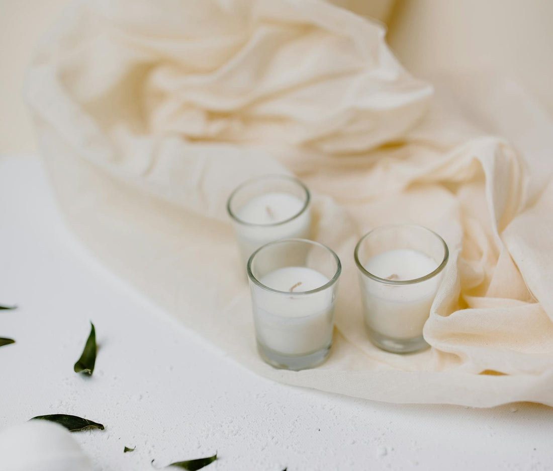 Best candle gifts for any occasion; best candle gifts; candle gift idea; white scented candle and cream cloth