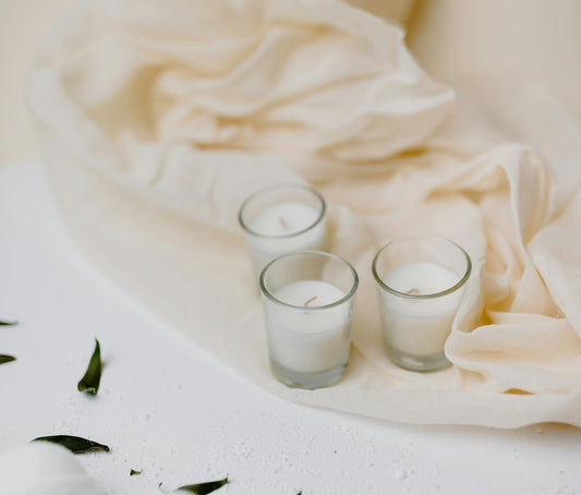 Best candle gifts for any occasion; best candle gifts; candle gift idea; white scented candle and cream cloth