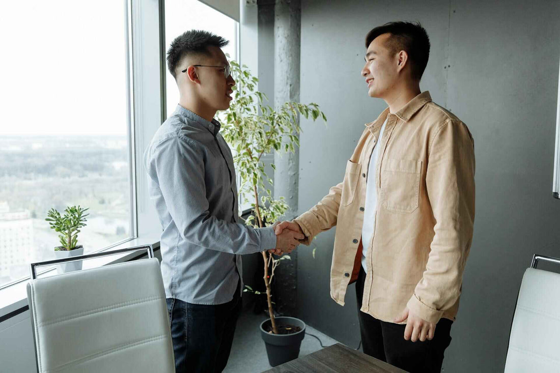 Corporate Gift Ideas to Impress Your Clients and Employees; Asian men shaking hands; corporate gift ideas