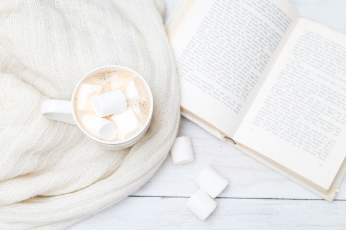 a cup of coffee and a book in hygge style