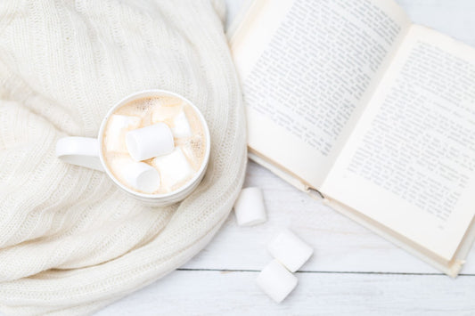 a cup of coffee and a book in hygge style